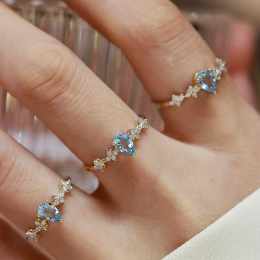 Anillo ajustable de plata con cristal azul para mujer