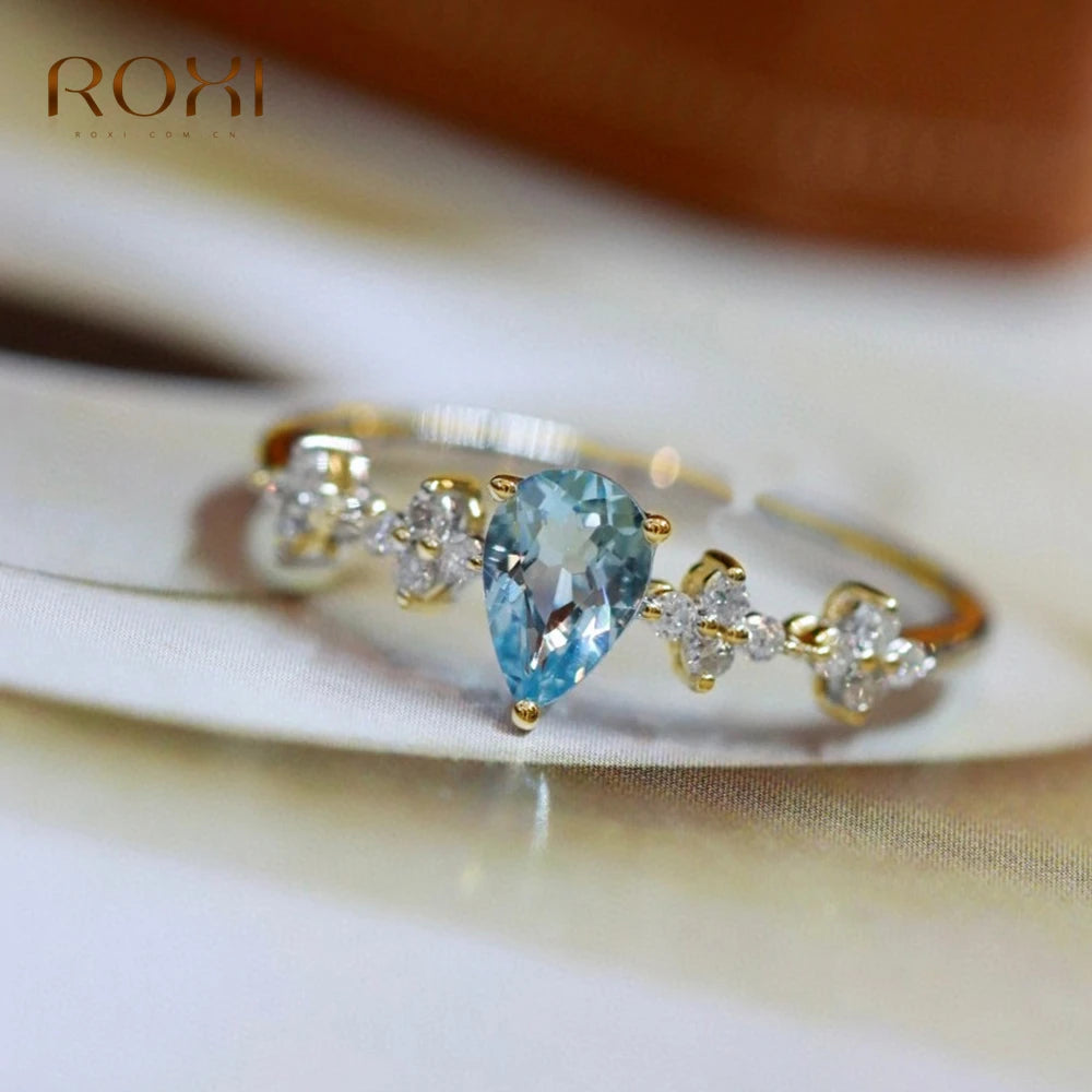 Anillo ajustable de plata con cristal azul para mujer