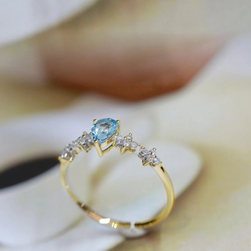 Anillo ajustable de plata con cristal azul para mujer