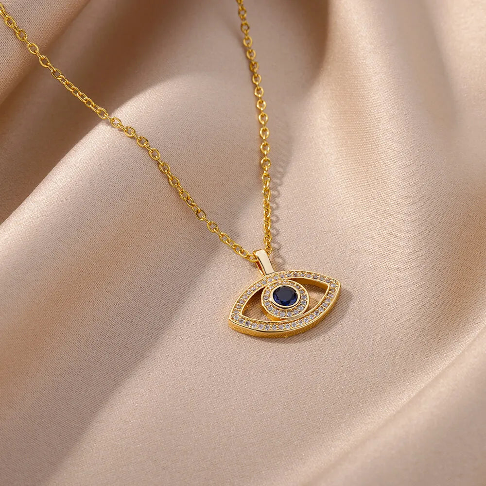 Collar con colgante de ojo malvado de circonita dorada para mujer