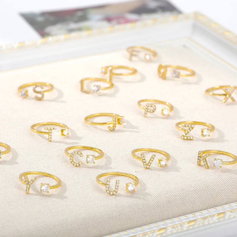 Anillo ajustable de acero inoxidable con baño 18k con hermosas circonias con letras unisex