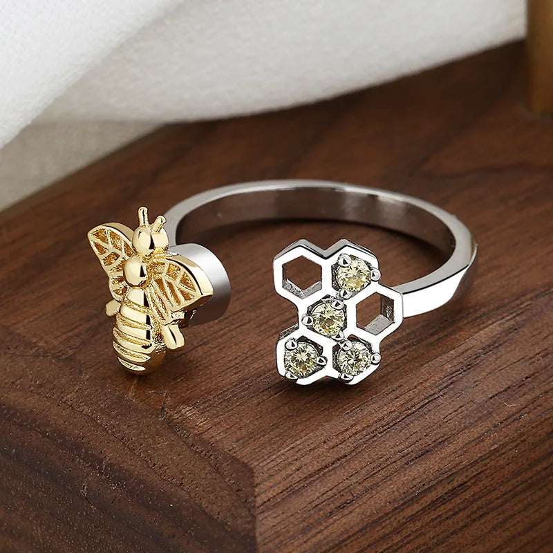Anillo Fidget Spinner con forma de panal de abeja para aliviar la ansiedad
