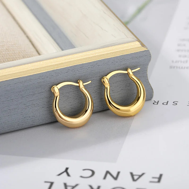 Pendientes minimalistas redondos de acero inoxidable para mujer