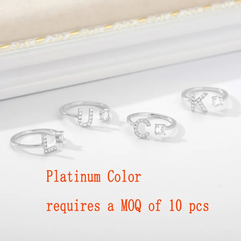 Anillo ajustable de acero inoxidable con baño 18k con hermosas circonias con letras unisex